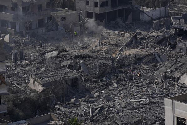Destruction from Israeli aerial bombardment is seen in Gaza City on October 11. - Sputnik Africa