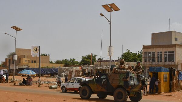 A French Army military vehicle belonging to a convoy of French troops is seen crossing the Lazaret district in Niamey on October 10, 2023.  - Sputnik Africa