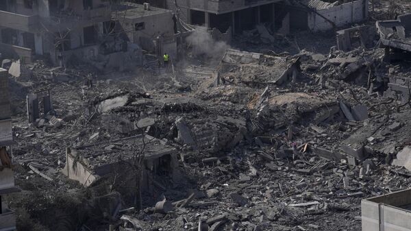 Destruction from Israeli aerial bombardment is seen in Gaza City on October 11, 2023. - Sputnik Africa