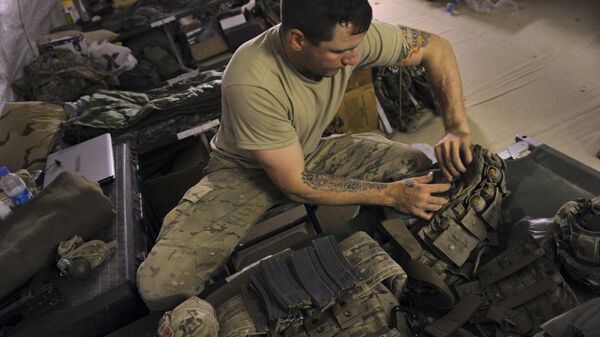 Private 2nd Class Justin McQuaid, 24, belonging to the US combat engineers known as Sappers, sorts ammunition and pack containing C-4 plastic explosives at the US combat engineers' barracks at the combat outpost Makuan of Bravo Company, 2-87 Infantry Battalion, 3rd Brigade Combat Team in Zahri district, southern Afghanistan on August 12, 2011, two days before the raid.  - Sputnik Africa