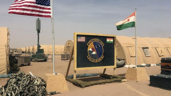 In this photo taken Monday, April 16, 2018, a U.S. and Niger flag are raised side by side at the base camp for air forces and other personnel supporting the construction of Niger Air Base 201 in Agadez, Niger. On the scorching edge of the Sahara Desert, the U.S. Air Force is building a base for armed drones, the newest front in America's battle against the growing extremist threat in Africa's vast Sahel region. Three hangars and the first layers of a runway command a sandy, barren field. Niger Air Base 201 is expected to be functional early next year.  - Sputnik Afrique