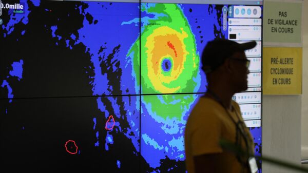 Forecasters monitor Cyclone Freddy at the France weather station, Meteo France, in Saint Denis de la Reunion, on the French overseas island of La Reunion on February 20, 2023 - Sputnik Africa
