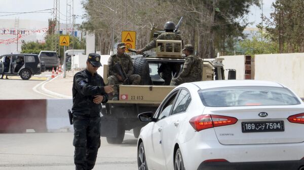 A policeman checks a car near Ghriba synagogue in Djerba, Tunisia, Wednesday May 10, 2023. - Sputnik Africa