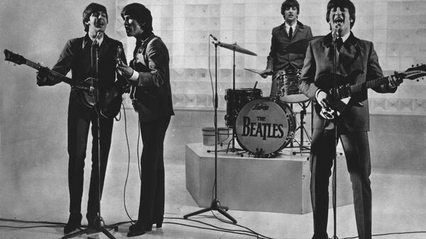 The Beatles are seen performing, date unknown. From left to right: Paul McCartney, George Harrison, Ringo Starr, and John Lennon. - Sputnik Africa