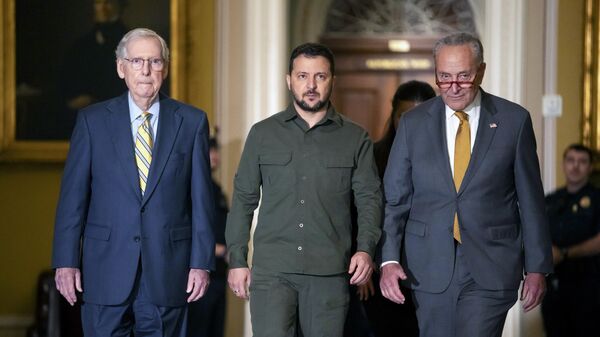  Ukrainian President Volodymyr Zelenskyy, center, walks with Senate Minority Leader Mitch McConnell of Ky., left, and Senate Majority Leader Chuck Schumer of N.Y., right, at Capitol Hill on Thursday, Sept. 21, 2023, in Washington. - Sputnik Africa
