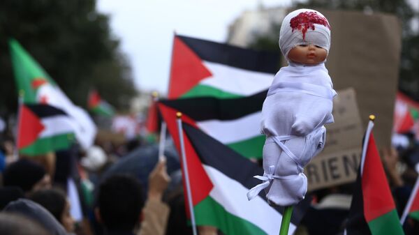 A mock dead baby is carried during a demonstration to support the Palestinian people in Gaza, Saturday, Nov. 4, 2023 in Paris.  - Sputnik Africa