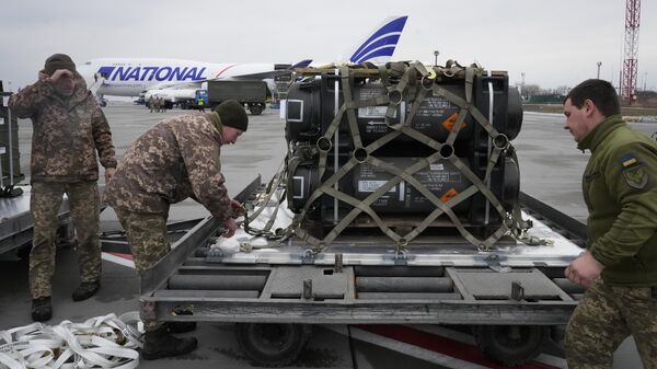 Ukrainian servicemen unpack shipment of military aid delivered as part of the United States of America's security assistance to Ukraine, at the Boryspil airport, outside Kyiv, Ukraine, Friday, Feb. 11, 2022.  - Sputnik Africa
