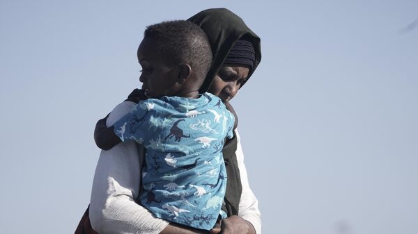 A Sudanese refugee - Sputnik Africa