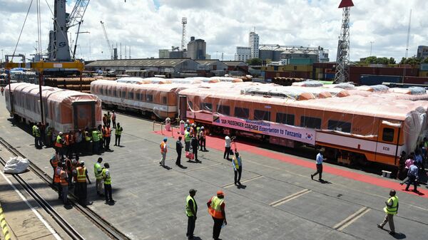 Carriages for the Tanzania's Standard Gauge Railway (SGR) project are unloaded as Tanzania received 14 economy class carriages of South Korean company Sung Shin Rolling Stock (SSRT) at the port in Dar es Salaam on November 25, 2022.  - Sputnik Africa