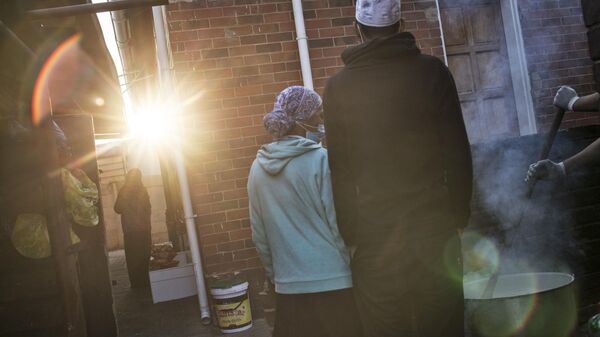 Volunteers of the non profit organisation and charity group Hunger has no Religion gather to cook porridge for breakfast for children at a nearby underprivileged areas, in Westbury suburb, in Johannesburg, on May 23, 2020, during a lockdown in the country to curb the spread of the COVID-19 (the novel coronavirus).  - Sputnik Africa