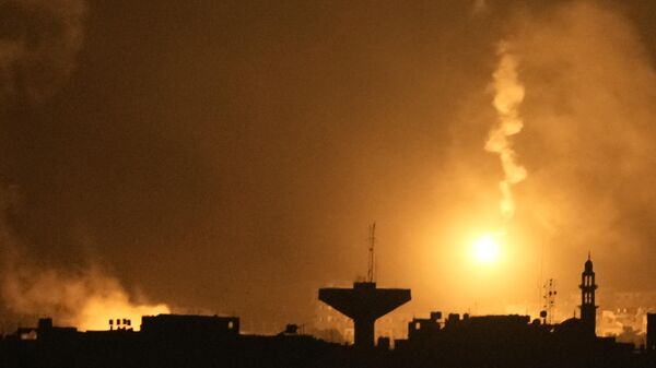 Flares rise over Gaza City in the Gaza Strip, as seen from southern Israel - Sputnik Africa