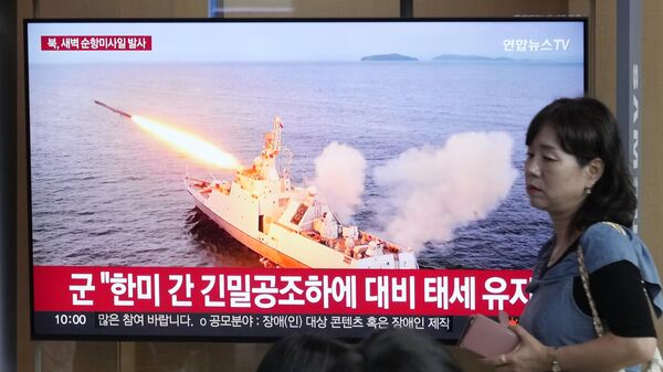 A TV screen shows a file image of North Korea's missile launch during a news program at the Seoul Railway Station in Seoul, South Korea, Saturday, Sept. 2, 2023. - Sputnik Africa