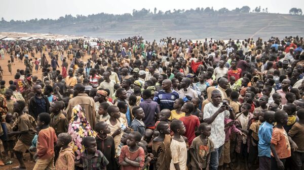 People displaced by conflict wait for the arrival of United Nations Under-Secretary-General for Peace Operations Jean Pierre Lacroix in Bunia, eastern Congo, Tuesday, Feb. 22, 2022. - Sputnik Africa