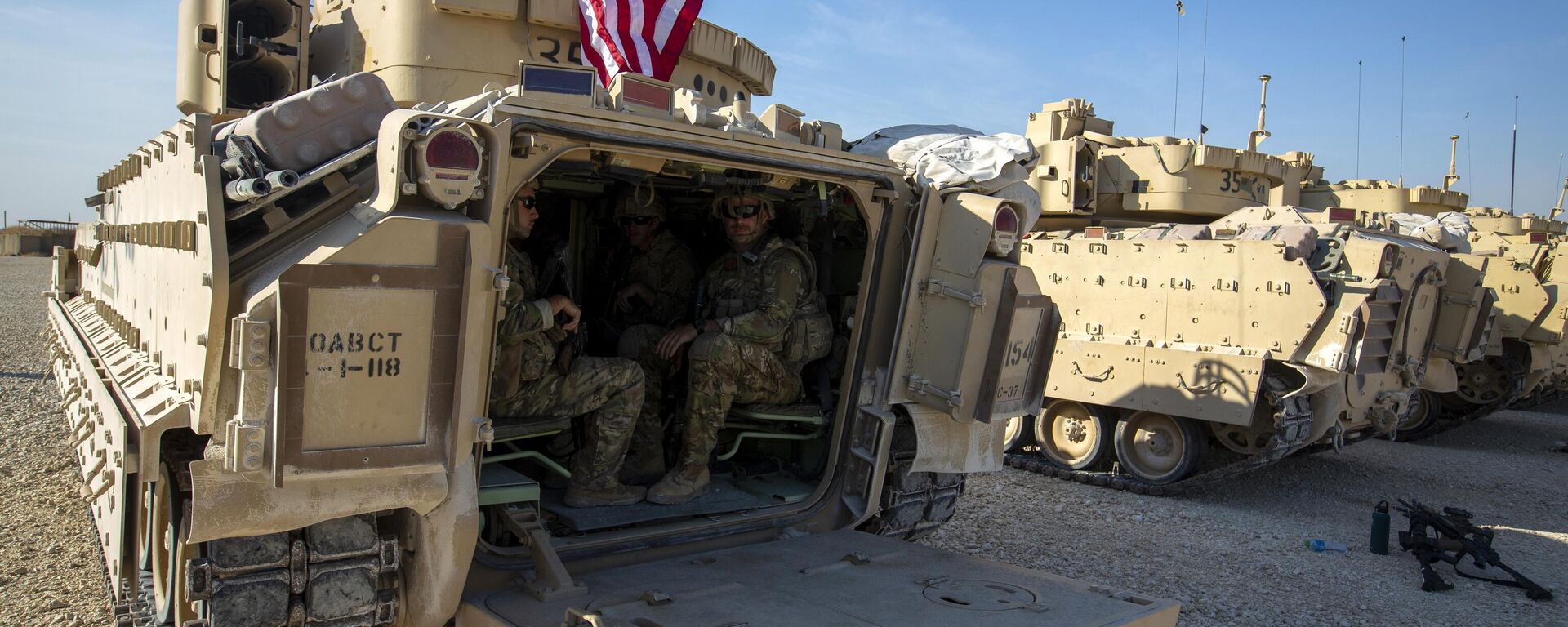 Crewmen sit inside Bradley fighting vehicles at a US military base at an undisclosed location in Northeastern Syria, Monday, Nov. 11, 2019. - Sputnik Africa, 1920, 18.11.2023