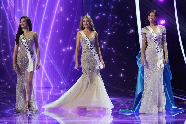 Miss Thailand Anntonia Porsild, from left, Miss Australia Moraya Wilson and Miss Nicaragua Sheynnis Palacios, react after being named the final three contestants during the 72nd Miss Universe pageant, in San Salvador, El Salvador, Saturday, Nov. 18, 2023 - Sputnik Africa
