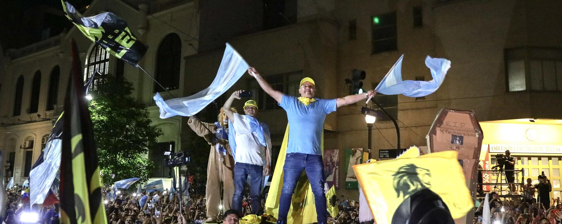 Supporters of the Argentine presidential candidate for the La Libertad Avanza alliance, Javier Milei, celebrate his victory in the presidential election runoff outside the party headquarters in Buenos Aires on November 19, 2023 - Sputnik Africa, 1920, 20.11.2023