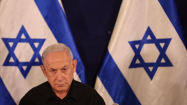Israeli Prime Minister Benjamin Netanyahu speaks during a press conference in the Kirya military base in Tel Aviv on October 28, 2023 amid ongoing battles between Israel and the Palestinian group Hamas. - Sputnik Africa