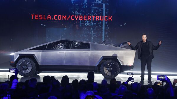 Tesla CEO Elon Musk introduces the Cybertruck at Tesla's design studio Thursday, Nov. 21, 2019, in Hawthorne, Calif. Musk is taking on the workhorse heavy pickup truck market with his latest electric vehicle.  - Sputnik Africa