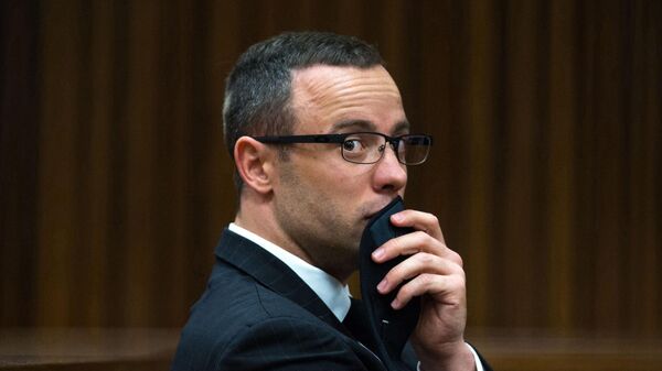 In this photograph taken on Tuesday, May 19, 2014, Oscar Pistorius listens to psychiatric evidence for his defense, during his ongoing murder trial in Pretoria, South Africa. - Sputnik Africa