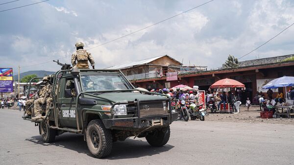 East African Community (EAC) force soldiers drive on a vehicle in Goma, eastern Democratic Republic of Congo, on December 2, 2022. - Sputnik Africa