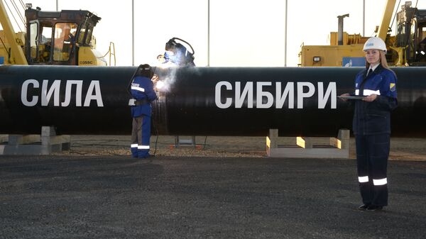 Welding at the connection ceremony of the first link of the Power of Siberia gas pipeline on the Namsky tract near the village of Us Khatyn in the presence of Russian President Vladimir Putin. - Sputnik Africa