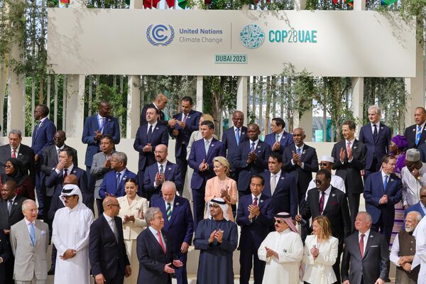 Participating world leaders and delegates arrive to pose for a family photo during the COP28 United Nations climate summit in Dubai on December 1, 2023. World leaders take center stage at UN climate talks in Dubai on December 1, under pressure to step up efforts to limit global warming, as the Israel-Hamas conflict casts a shadow over the summit. - Sputnik Africa
