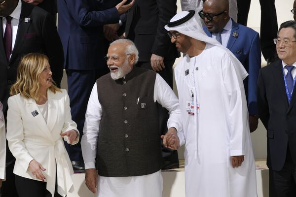 India Prime Minister Narendra Modi, center, and COP28 President Sultan al-Jaber arrive for a group photo at the COP28 U.N. Climate Summit, Friday, Dec. 1, 2023, in Dubai, United Arab Emirates. - Sputnik Africa
