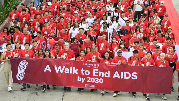 Participants take part in the walk to end AIDS event to mark World Aids Day in Manila on December 2, 2023. - Sputnik Africa