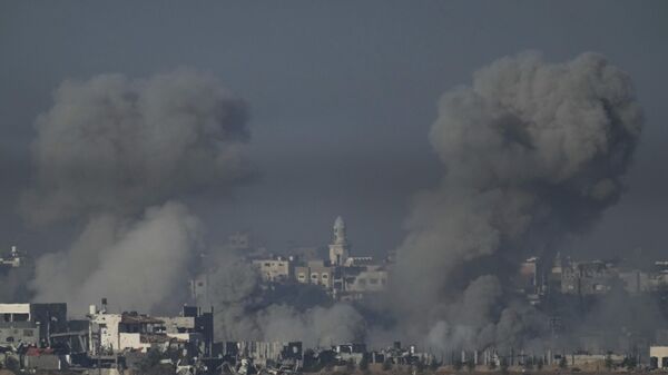 Smoke rises following an Israeli bombardment in the Gaza Strip, as seen from southern Israel - Sputnik Africa