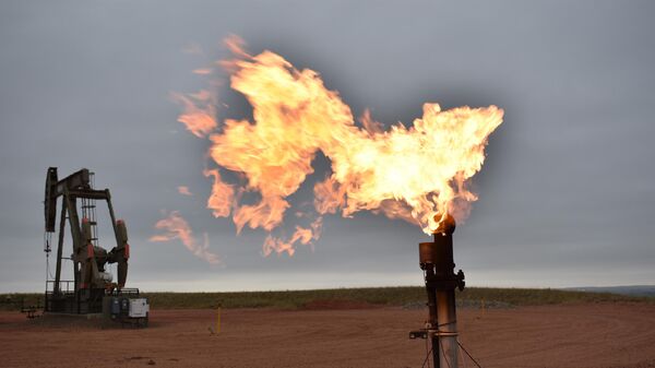 A flare burns natural gas at an oil well Aug. 26, 2021, in Watford City, N.D. Consumers of natural gas are facing the prospect of much higher heating bills this winter.  - Sputnik Africa