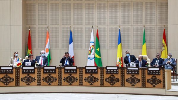 French President Emmanuel Macron, second left, listens as Mauritania president Mohamed Ould Cheikh El Ghazouani, third right, speaks during the G5 Sahel summit Tuesday, June 30, 2020, in Nouakchott. Leaders from the five countries of West Africa's Sahel region, Burkina Faso, Chad, Mali, Mauritania and Niger, meet with French President Emmanuel Macron and Spanish Prime Minister Pedro Sanchez in Mauritania's capital Nouakchott on Tuesday to discuss military operations against Islamic extremists in the region, as jihadist attacks mount.  - Sputnik Africa