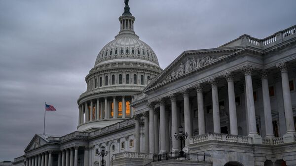The Senate side of the Capitol is seen in Washington, early Thursday, Dec. 22, 2022, as lawmakers rush to complete passage of a bill to fund the government before a midnight Friday deadline, at the Capitol in Washington, Thursday, Dec. 22, 2022. - Sputnik Africa