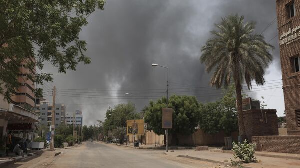Smoke is seen rising in Khartoum, Sudan, Saturday, April 15, 2023. - Sputnik Africa