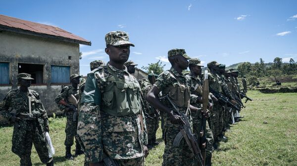 Ugandan soldiers of the East African Community Regional Force (EACRF) stand in formation in Bunagana, Democratic Republic of Congo, on April 19, 2023. - Sputnik Africa