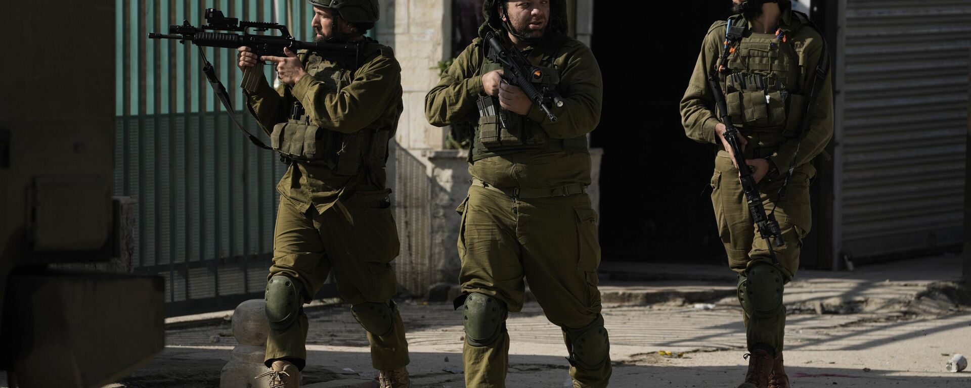 Israeli soldiers are seen during an army operation, in the Jenin refugee camp, West Bank, Tuesday, Dec. 12, 2023.  - Sputnik Africa, 1920, 12.12.2023