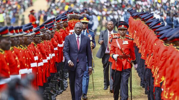 Kenyan President William Ruto, center left, inspects a guard of honor parade, during the 60th Jamhuri Day Celebrations (Independence Day) at Uhuru gardens Stadium in Nairobi, Tuesday, Dec. 12, 2023.  - Sputnik Africa