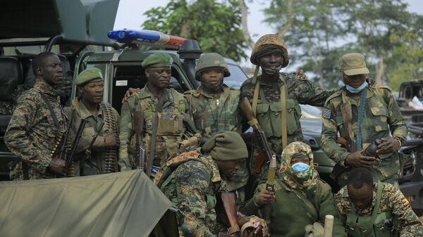 Uganda People's Defence Forces (UPDF) troops are seen on the Mbau-Kamango road in the Beni district on December 8, 2021.  - Sputnik Africa