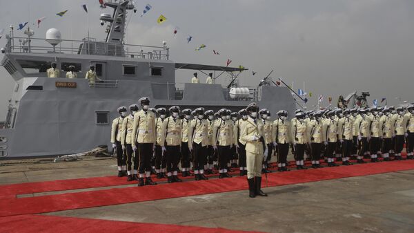 Nigeria Naval officers stand in front of a newly commissioned locally made warship in Lagos, Nigeria, Thursday, Dec. 9, 2021.  - Sputnik Africa