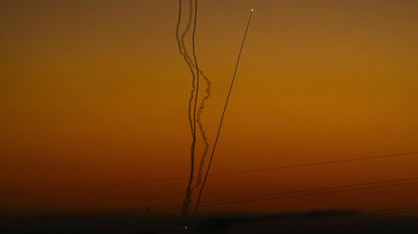 Rockets are fired toward Israel from the Gaza Strip, as seen from southern Israel, Friday, Dec. 15, 2023. - Sputnik Africa