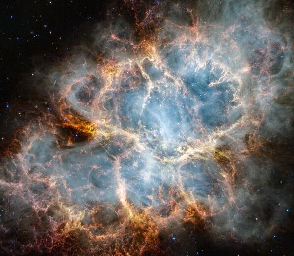 The NASA/ESA/CSA James Webb Space Telescope has gazed at the Crab Nebula in the search for answers about the supernova remnant’s origins. Webb’s NIRCam (Near-Infrared Camera) and MIRI (Mid-Infrared Instrument) have revealed new details in infrared light.  - Sputnik Africa