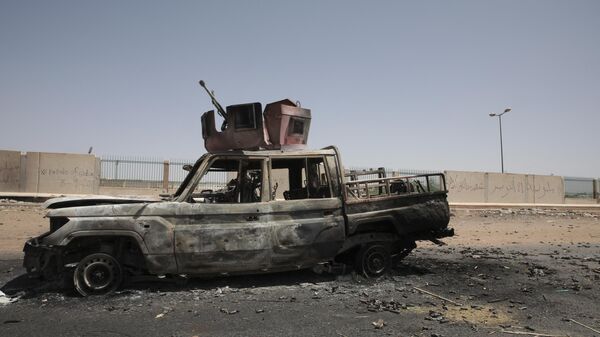 A destroyed military vehicle is seen in southern in Khartoum, Sudan, on April 20, 2023.  - Sputnik Africa