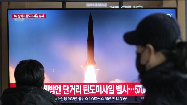 A TV screen shows a file image of North Korea's missile launch during a news program at the Seoul Railway Station in Seoul, South Korea, Monday, Dec. 18, 2023. - Sputnik Africa