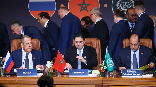 In this handout photo released by the Russian Foreign Ministry, Russian Foreign Minister Sergey Lavrov, his Moroccan counterpart Nasser Bourita, and Arab League Assistant Secretary General Hossam Zaki attend the 6th plenary session of the Russian-Arab Cooperation Forum, in Morocco on Wednesday, December 20, 2023.  - Sputnik Africa