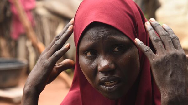 Hafsatu Usman, a mother of 7 children who lost track of three of them while fleeing from an army attack on her village controlled by jihadists in 2014, speaks at Malkohi internally displaced person (IDP) Camp in Yola, Adamawa State in northern Nigeria, on August 31, 2022. - Sputnik Africa