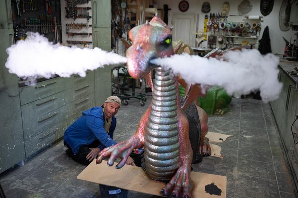 Laci Endresz Jr., who performs as Mooky the Clown in The Blackpool Tower Circus, poses for a photograph as he constructs a dragon circus prop in his workshop in Blackpool, northern England on January 16, 2023. The dragon, one of three being created by Laci, will feature in The Blackpool Tower Circus&#x27; show finale - floating on water whilst being ridden by circus performers and breathing smoke from its nostrils.  - Sputnik Africa