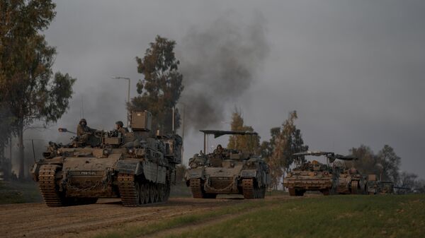 A convoy of Israeli army armoured personnel carriers (APC) moves near the Israeli-Gaza border, in southern Israel - Sputnik Africa