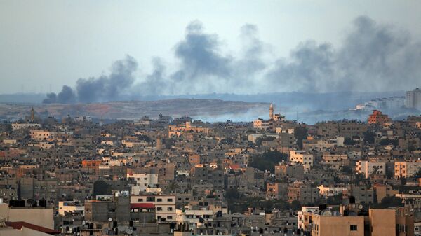 Smoke rises after an Israeli missile strike hit the northern Gaza Strip, Thursday, July 17, 2014. - Sputnik Africa
