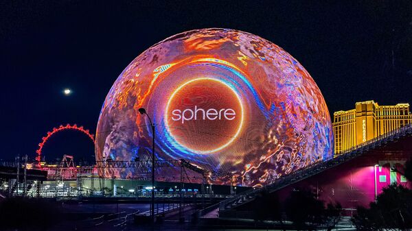 Sphere in Paradise, Nevada, with the grandstands from the Formula 1 race a couple of days before visible. Sphere is 366 feet (112 m) high and 516 feet (157 m) wide at its broadest point. It is the largest spherical building in the world at 875,000 sq ft (81,300 m2). - Sputnik Africa