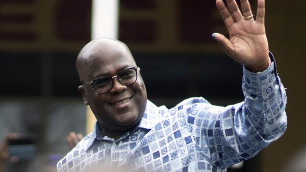Congo's President Felix Tshisekedi waves to his supporters after casting his ballot inside a polling station during the presidential elections in Kinshasa, Democratic Republic of Congo, Wednesday, Dec. 20, 2023. - Sputnik Africa