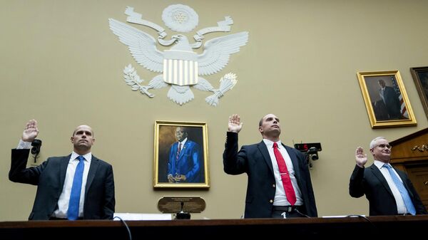 Ryan Graves, Americans for Safe Aerospace Executive Director, from left, U.S. Air Force (Ret.) Maj. David Grusch, and U.S. Navy (Ret.) Cmdr. David Fravor, are sworn in during a House Oversight and Accountability subcommittee hearing on UFOs, Wednesday, July 26, 2023, on Capitol Hill in Washington. - Sputnik Africa